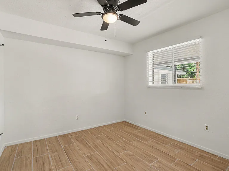 Downstairs room could be used as bedroom or home office.
