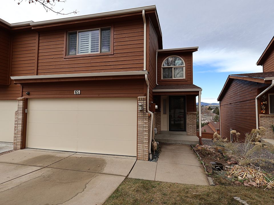 Front entry, with two-car driveway and garage access also shown.