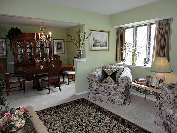 Formal Living/Dining...beautifully carpeted and draped...says luxury!