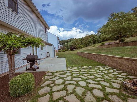 Back patio and fire pit area for grilling, entertaining and relaxing.