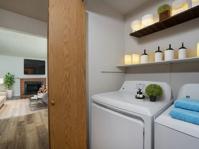 Experience the convenience and warmth of home with this integrated laundry and living room space. Experience the convenience and warmth of home with this integrated laundry and living room space.