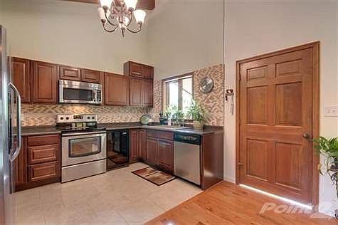 Ceramic tile floor, backsplash, chandelier