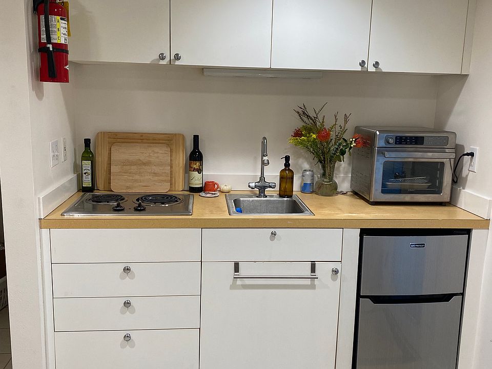 Kitchen includes fridge, freezer, stove top and convection oven.