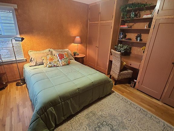 Lots of closet space and built in bookshelves and desk. Beautiful hardwood floors.