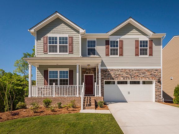 Hampton Exterior 7 features stone, shakes, siding, covered front porch 2 car garage