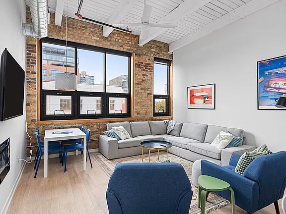 Open concept, very spacious living space. Room for a dining table.