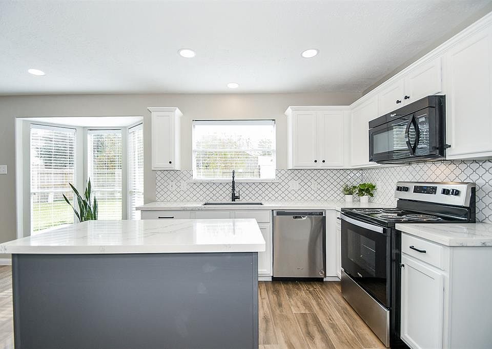 Updated kitchen- Quartz counters - love the natural light