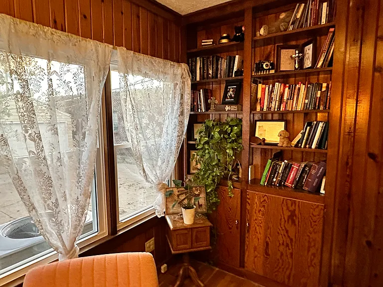 Office with French doors and built-in book shelves