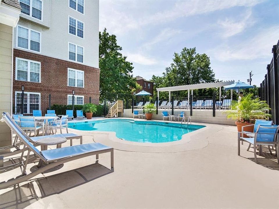 Sparkling Pool & Sundeck with Relaxing Lounge Chairs