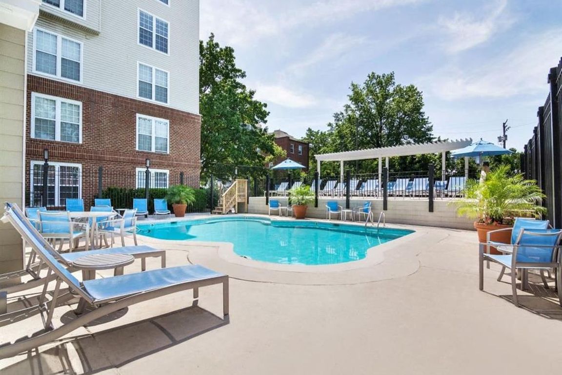 Sparkling Pool & Sundeck with Relaxing Lounge Chairs