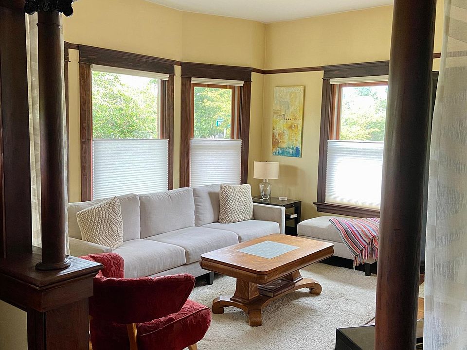 Living room with decorative fireplace.