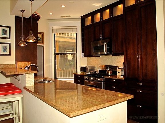 Kitchen with stainless steel appliances and granite counter