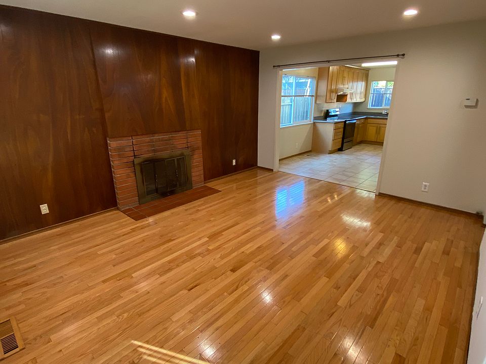 Family room and fireplace. Recessed overhead lighting