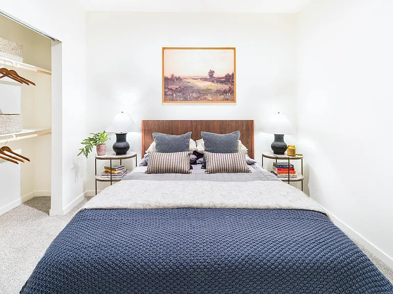 A calming bedroom at Modera University Park, paired with a spacious closet and soft finishes designed for everyday comfort.