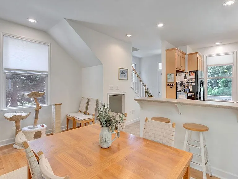 View from dining area to kitchen and stairs