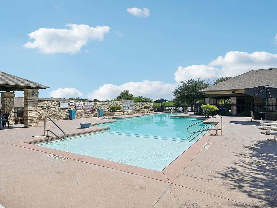 Unwind at the sparkling pool surrounded by lounge seating at Arroyo Seco Villas.