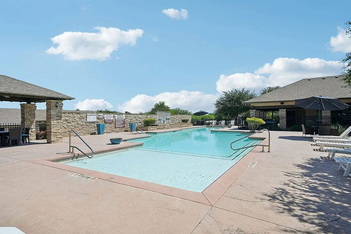 Unwind at the sparkling pool surrounded by lounge seating at Arroyo Seco Villas. - Arroyo Seco Villas