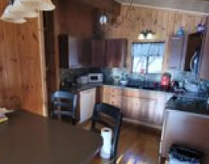 Island four chairs facing the kitchen