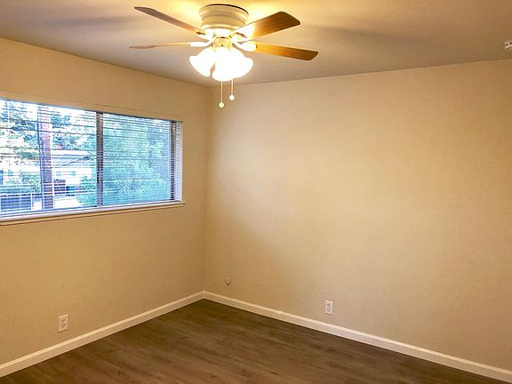 1st bedroom 10x12 feet with ceiling fan and large closet featured in next photo.