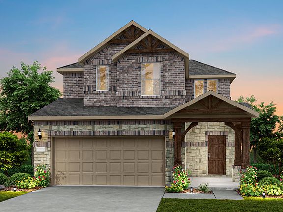 The Crested Butte, a two-story home with 2-car garage, shown with Home Exterior T