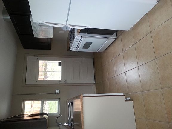 kitchen walking out to back door and yard