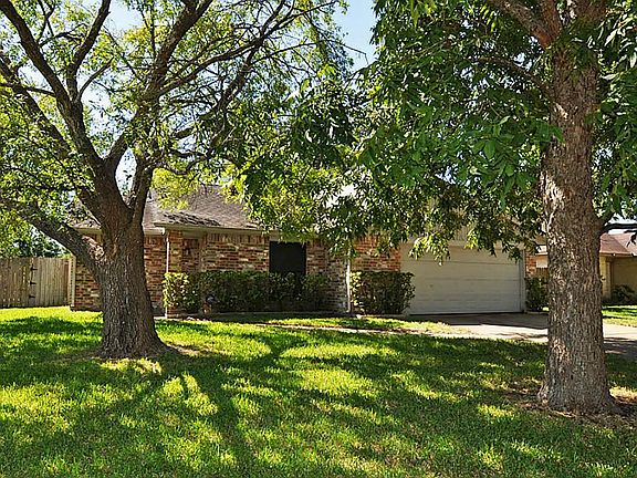 Two large shade trees are featured along with great curb appeal.