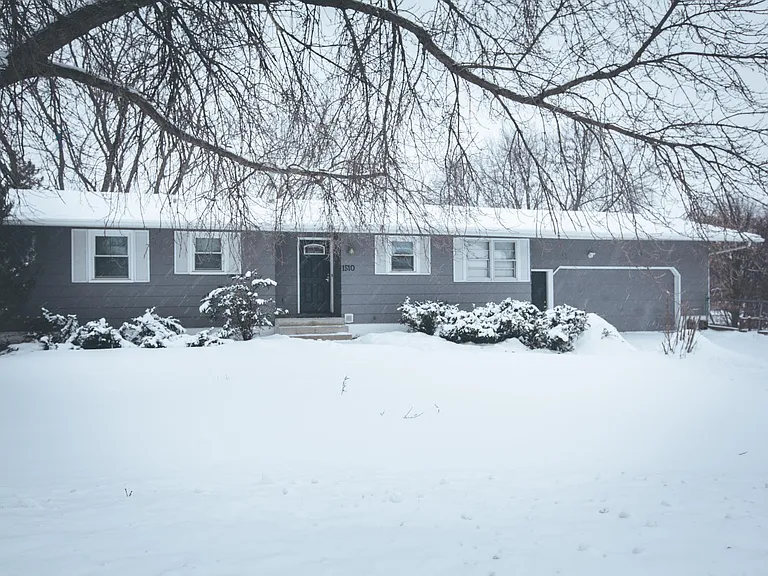 Front of the house. Rambler painted gray.