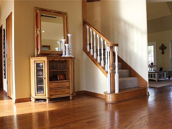 Beautiful entry with amazing real wood floors that are carried thru the family room, hall & kitchen