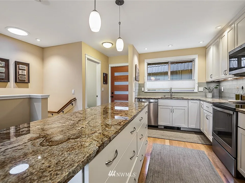 2016 remodel opened the kitchen and added the island, granite, and stainless appliances.  Pull-out shelving is featured in much of the below-counter cabinetry.  