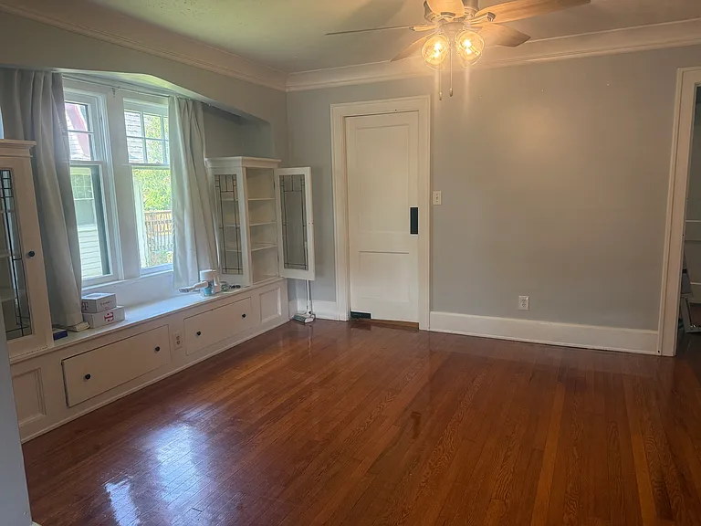 Dining room living room view and swinging door to kitchen