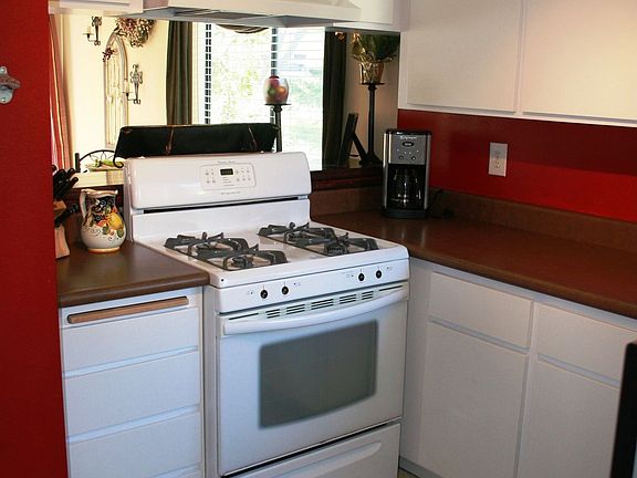 Kitchen looks out to living room