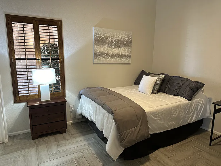 Bedroom 3 with Queen Bed and large desk.