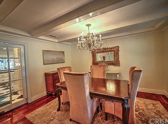 Dining room with beveled and leaded glass windows,