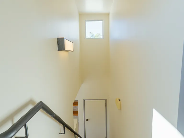 View looking down the stairs to the first floor.