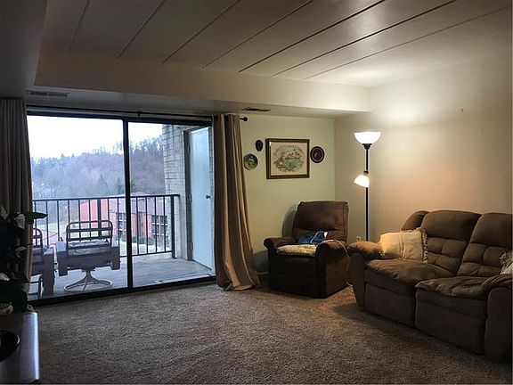 Living Room with a view of private balcony.