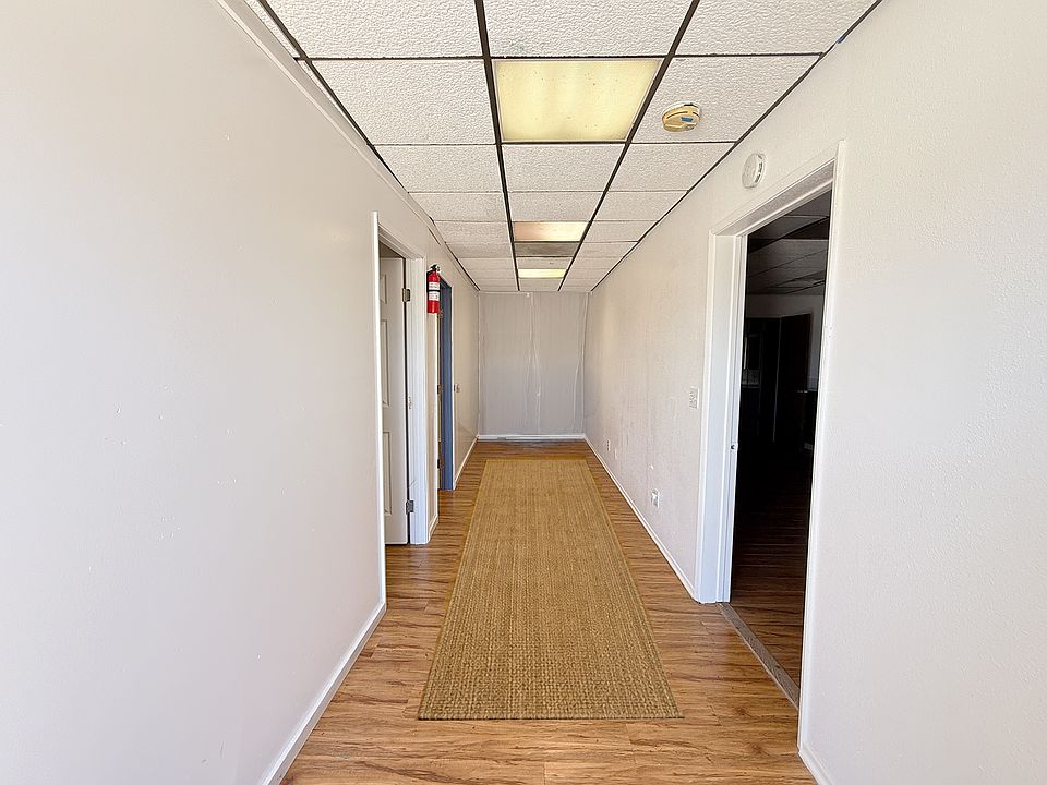 Entry Hallway. Bedrooms to the left, kitchen, den, common area bathroom to the right. Washer and dryer included.