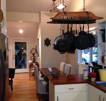 Open Kitchen : Hand forged pot rack by owner. Blown glass/copper ceiling lights by owner.