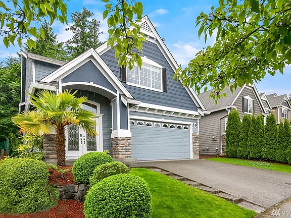 A built-in mist watering systems helps keep the maintenance low on this well landscaped front yard.