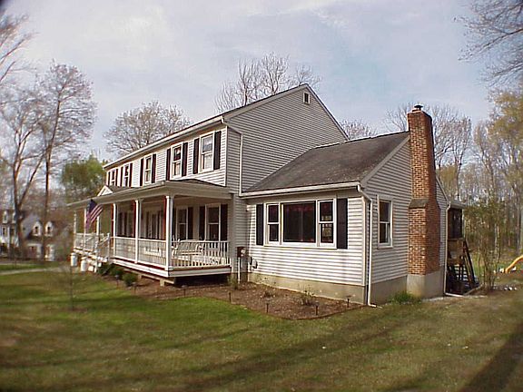 Family room with fireplace on end.