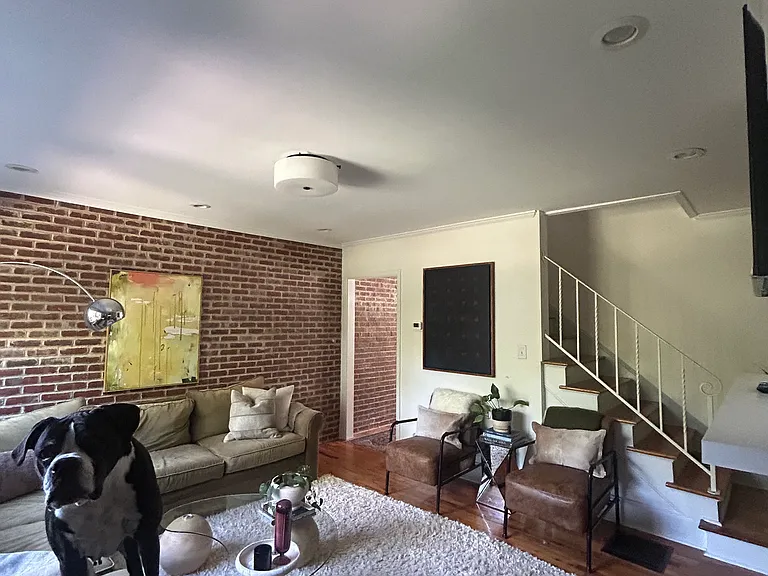 living area with access to back patio & courtyard