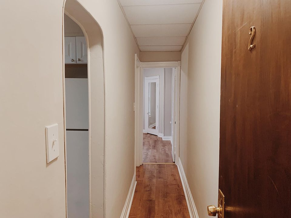 Entrance and hallway. Kitchen is to the left. Bathroom is next door on the left. Bedroom (or living room) is in the back.