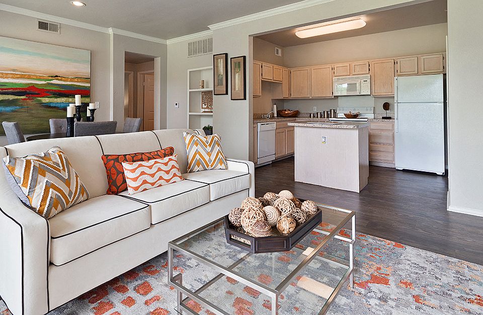 Spacious Living Room and Kitchen with Quartz Countertops, White Appliances, and Island