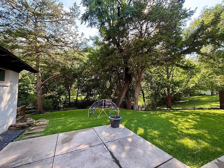 Large backyard with creek access.