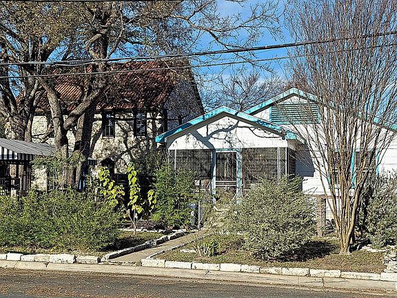 Front view of house and neighbors house.
