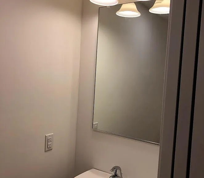 Powder room with pocket doors, First floor.