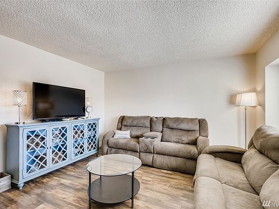 Good sized living room with large windows