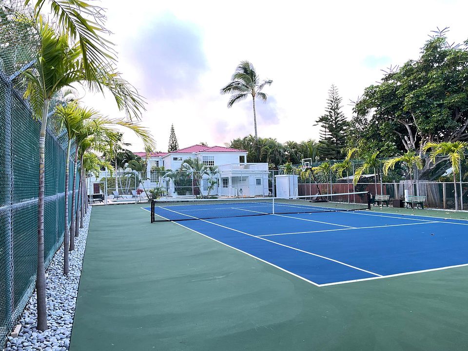 Private tennis court, pool and home.