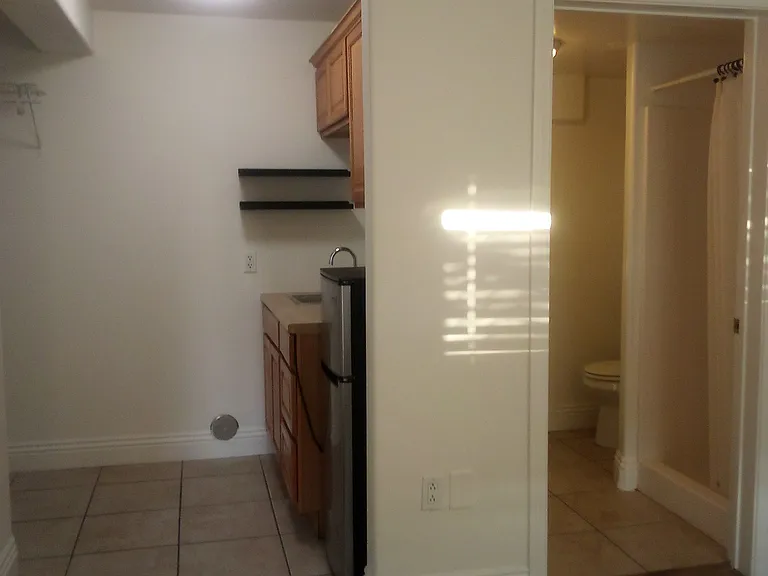 Downstairs bedroom with mini kitchen
