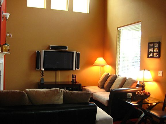 Expansive TV room with fireplace and 16' ceilings