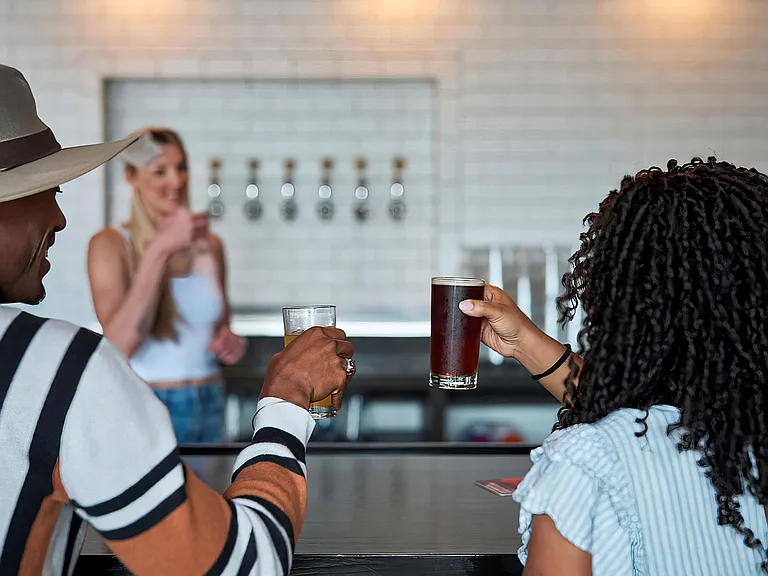 Share a laugh over drinks at a local bar